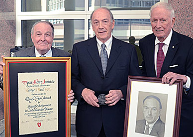 Dr. George Reul accepts the 2012 Ray C. Fish award from Dr. James T. Willerson (left) and Dr. Denton A. Cooley (right)