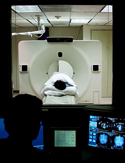 Photo showing the view from the control room during a CT scan.